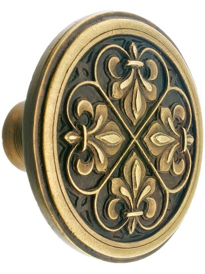 Fleur-de-Lis Cabinet Knob - 1 3/8 inch Diameter in Antique Brass.